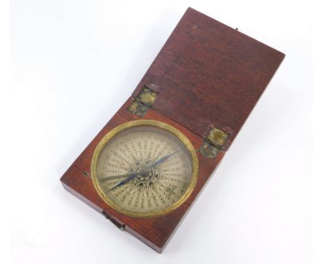 A Georgian pocket compass, c1800, with a blue steel needle, mahogany cased.