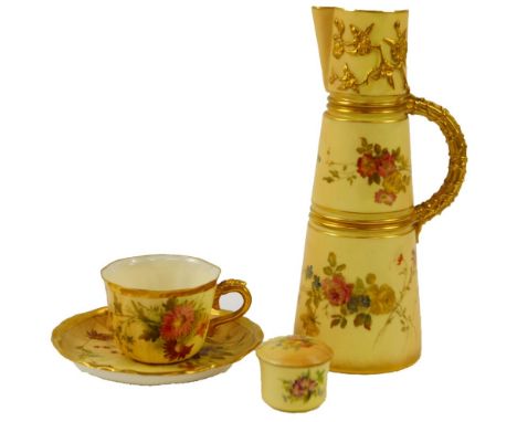 A Royal Worcester blush porcelain cup and saucer, c1921, decorated with meadow flowers, together with a blush porcelain jug, 