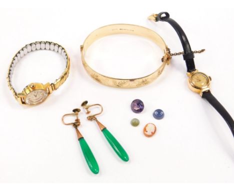 Two lady's gold plated Omega wrist watches, gold plated bangle with foliate engraving, on a snap clasp with safety chain, pai