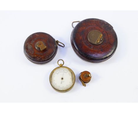 A Chestermans Patent tape measure, Dean of London tape measure, a fruitwood cased tape measure, and a Dollond of London brass