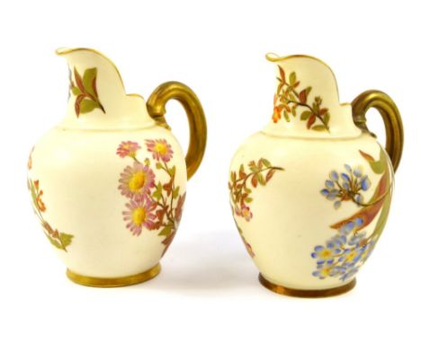 A pair of Royal Worcester blush porcelain jugs, of compressed form, decorated with meadow flowers, c1886 and 1887, No 1094, p