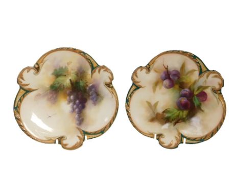 A pair of Hadley's Worcester porcelain dessert plates, circa 1905, of trefoil form, painted with fruit within a moulded scrol
