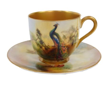 A Royal Worcester porcelain coffee cup and saucer, painted with a peacock, by M Price, c1926, printed mark.