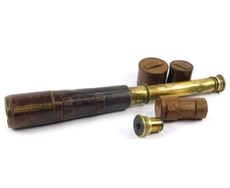 A Broadhurst Clarkson & Company brass three drawer telescope, leather bound, and a cased optic. (2)