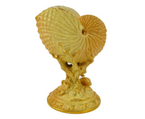 A Royal Worcester porcelain nautilus shell vase, c1934, raised on a coral and shell stem and circular base, No 4/94, printed 