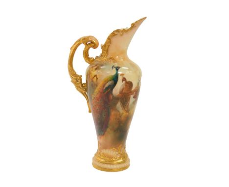 A Royal Worcester porcelain jug painted with peacocks, circa 1918, of baluster form, with gilt foliate scroll handle, signed 