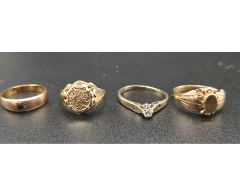 A group of four rings, 9 K yellow gold, including one with a half sovereign, one with diamonds, and one with sapphire. total 