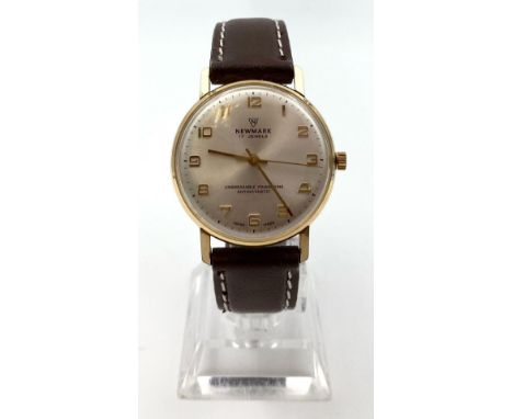A Vintage Newmark Mechanical Gents Watch. Leather strap. Two tone case - 35mm. In working order.