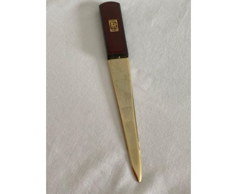 Extremely rare vintage Rolls-Royce letter opener having burgundy leather handle and gold coloured blade.Presented in a burgun