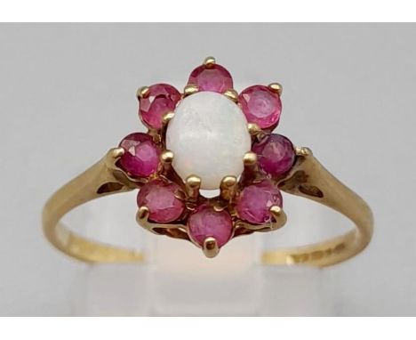 A 9K Yellow Gold Opal and Ruby Ring. Size M. 1.25g. 