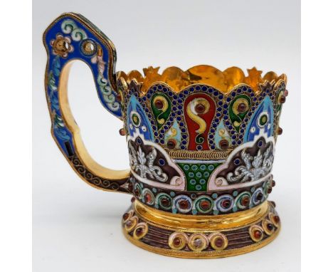 An Unusual Russian Silver and Cloisonné Enamel Tea Glass Cup Holder. Gem-set decoration with a richly gilded interior. 10 x 1