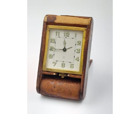 A Vintage Jaeger Le Coultre traveling clock in custom made leather case/night stand. Swiss made, in working order. 