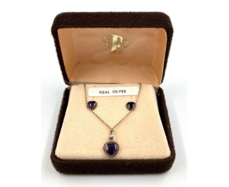 A VINTAGE SILVER AND HEART SHAPED AMETHYST EARRING STUDS AND PENDANT SET.   2.4gms 