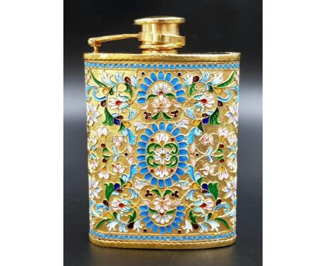 A Delightful Russian Silver and Cloisonné Enamel Hip Flask. Floral decoration and rich gilding throughout.Hinged lid with scr