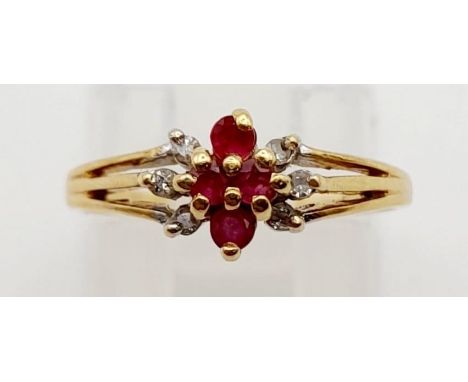 A 14K Yellow Gold Diamond and Ruby Cluster Ring. Size J. 1.7g 