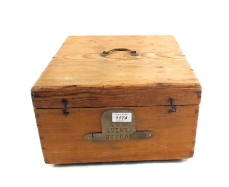 A pine box with brass plaque marked Col Bulwer Heydon containing a vintage straw boater