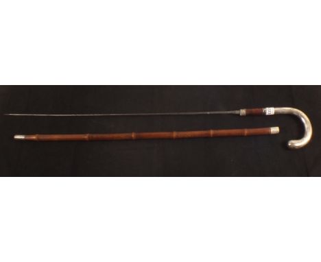 A sword stick within cane scabbard with continental silver handle