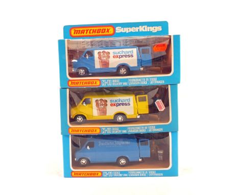 Three boxed Matchbox K-11 Superkings, Dodge delivery van Suchard Express (one yellow, one blue) and Dodge delivery van with G