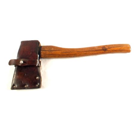 A Swiss military hand axe with leather sheath, dated 1940