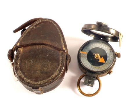 A WWI era compass within its 1917 dated leather case