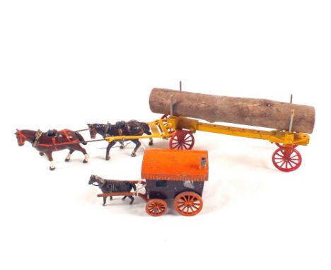 A Salco gypsy caravan in brown and orange plus a die cast horse drawn log cart, possibly by Charbens