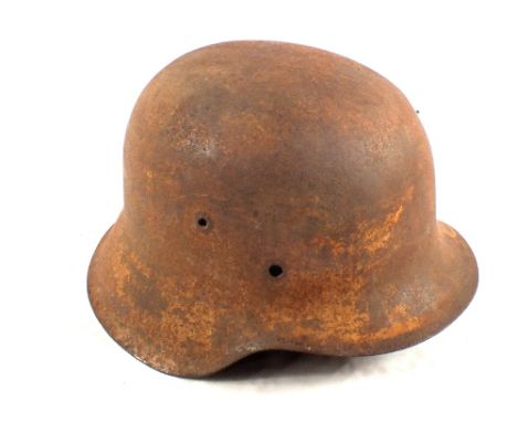 A German M42 steel helmet (shell) with traces of white winter camouflage 