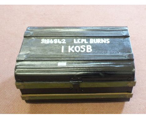 A painted tin trunk marked 3186842 L/Cpl Burns I. Kosb with contents including Gortex boots, stable belt etc