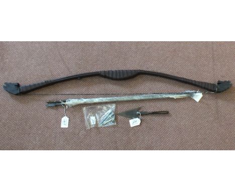 A leather clad bow with arrows, three Howard Hill arrowheads and a barbed ethnic spear head