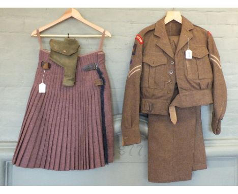 A Post War uniform dated 1955 consisting of battle dress blouse, trousers and kilt with insignia for London Scottish Regiment