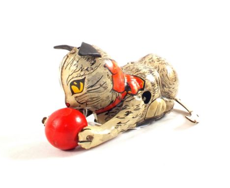 A Mary clockwork tin plate cat playing with red ball