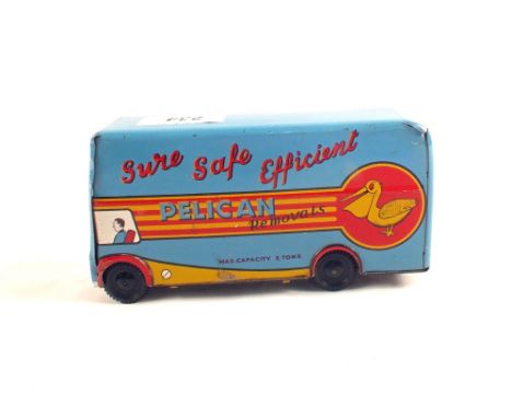 A Wells Brimtoy tin plate clockwork jumping rabbit and a Wells Brimtoy tin plate friction drive 'Pelican' removals van