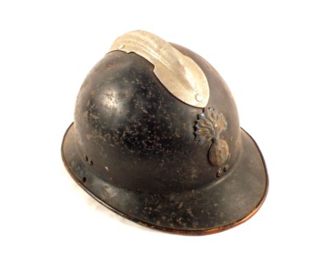 A French WWII helmet with applied R.F. badge (no liner)