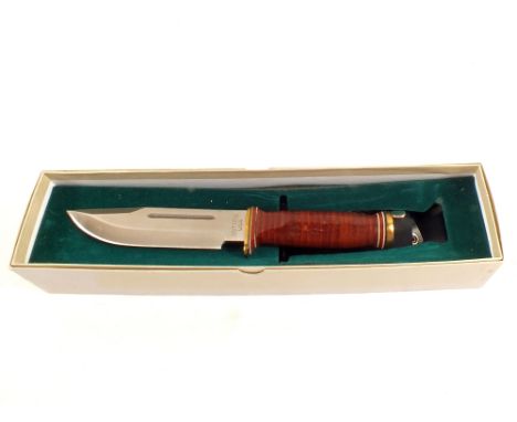 A boxed combat knife blade marked Quartermaster Army 95 Ontario U.S.A., with a scabbard