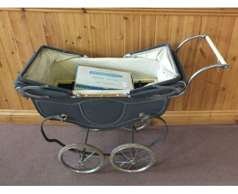 A 1950's dolls pram plus a boxed Chad Valley washing machine