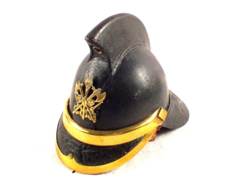 A Victorian leather firemans helmet with brass furniture