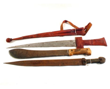 Two ethnic swords, one with scabbard and a machete