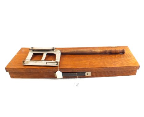 A custom made gun box with a vintage I.C.I. hand clay thrower
