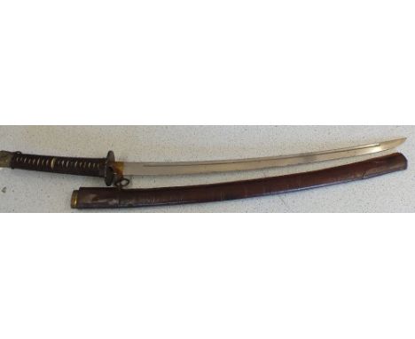 A Japanese emergency issue WWII military shin-gunto with 26 1/2" blade, within its leather covered scabbard