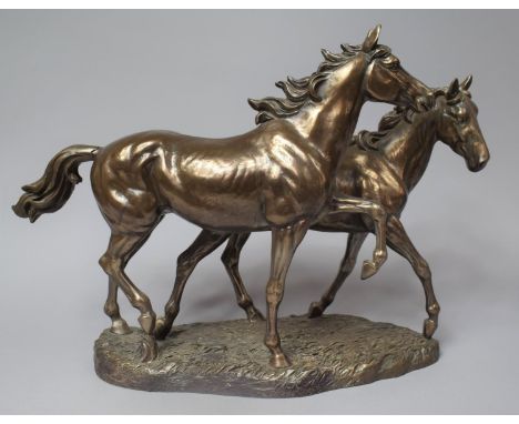 A Bronze Effect Sculpture Depicting Two Horses, One with Tail Glued, 46cm Long 