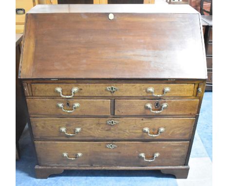 A Georgian Mahogany and Fall Front Bureau with Fitted Interior Having Pigeon Holes, Small Drawers and Central Cupboard, the B