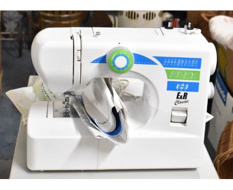 A Modern E&amp;R Classic Electric Sewing Machine, with Instruction Booklets 