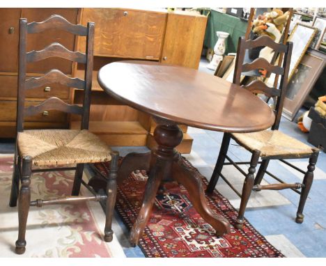 A Late Victorian Oval Mahogany Snap Top Table on Scrolled Supports with Pair of Rush Seated Ladder Back Oak Framed Chairs 