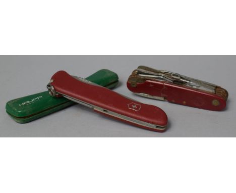 A Modern Pruning Knife Together with Two Swiss Army Style Multi Tool Knives 
