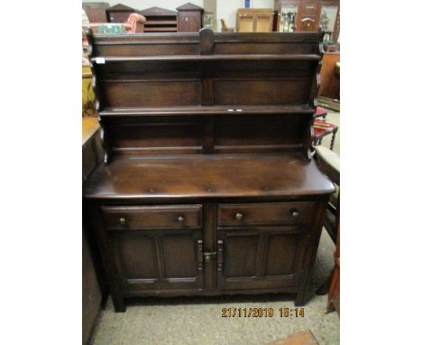 DARK STAINED DRESSER, THE TOP FITTED WITH TWO FIXED SHELVES AND PANELLED BACK, THE BASE WITH TWO DRAWERS OVER TWO CUPBOARD DO
