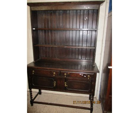 OAK FRAMED DRESSER, THE TOP FITTED WITH TWO FIXED SHELVES AND PANELLED BACK, THE BASE WITH TWO DRAWERS OVER TWO CUPBOARD DOOR