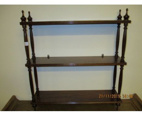 MAHOGANY FRAMED THREE TIER SHELF UNIT WITH TURNED COLUMN SUPPORTS