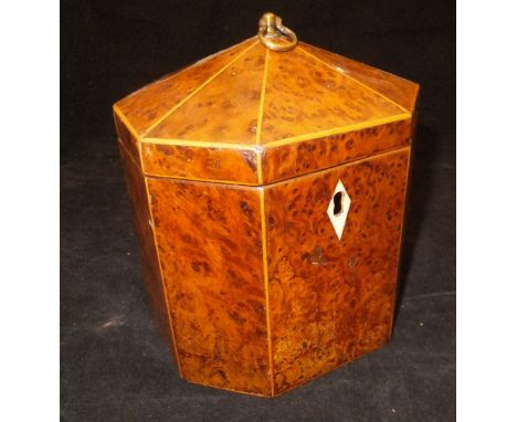 A George III burr yew and boxwood strung tea caddy of pagoda form, the faceted conical top with a brass loop handle, raised o