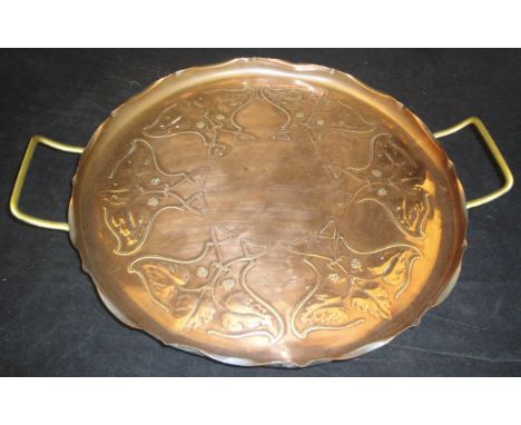 A Joseph Sankey & Sons embossed copper tray in the Art Nouveau taste, embossed with hop and leaf decoration, with crimped rim