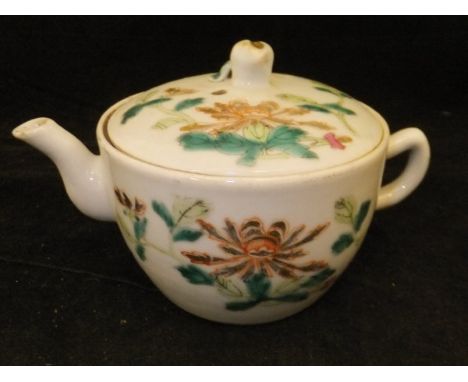 A Chinese famille rose teapot and cover, or Saki pot, with floral spray and ribbon tied brush and sceptre decoration, bears f