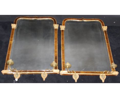 A pair of George II walnut and gilded girandole mirrors with moulded decoration, the Vauxhall plate flanked by acanthus cappe